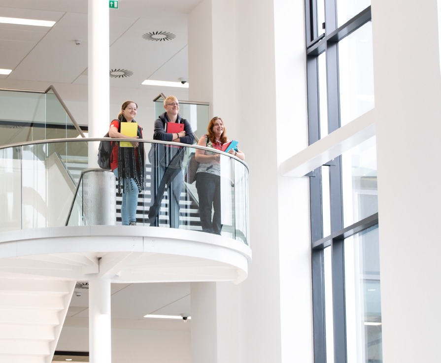 Students looking out from stairs.