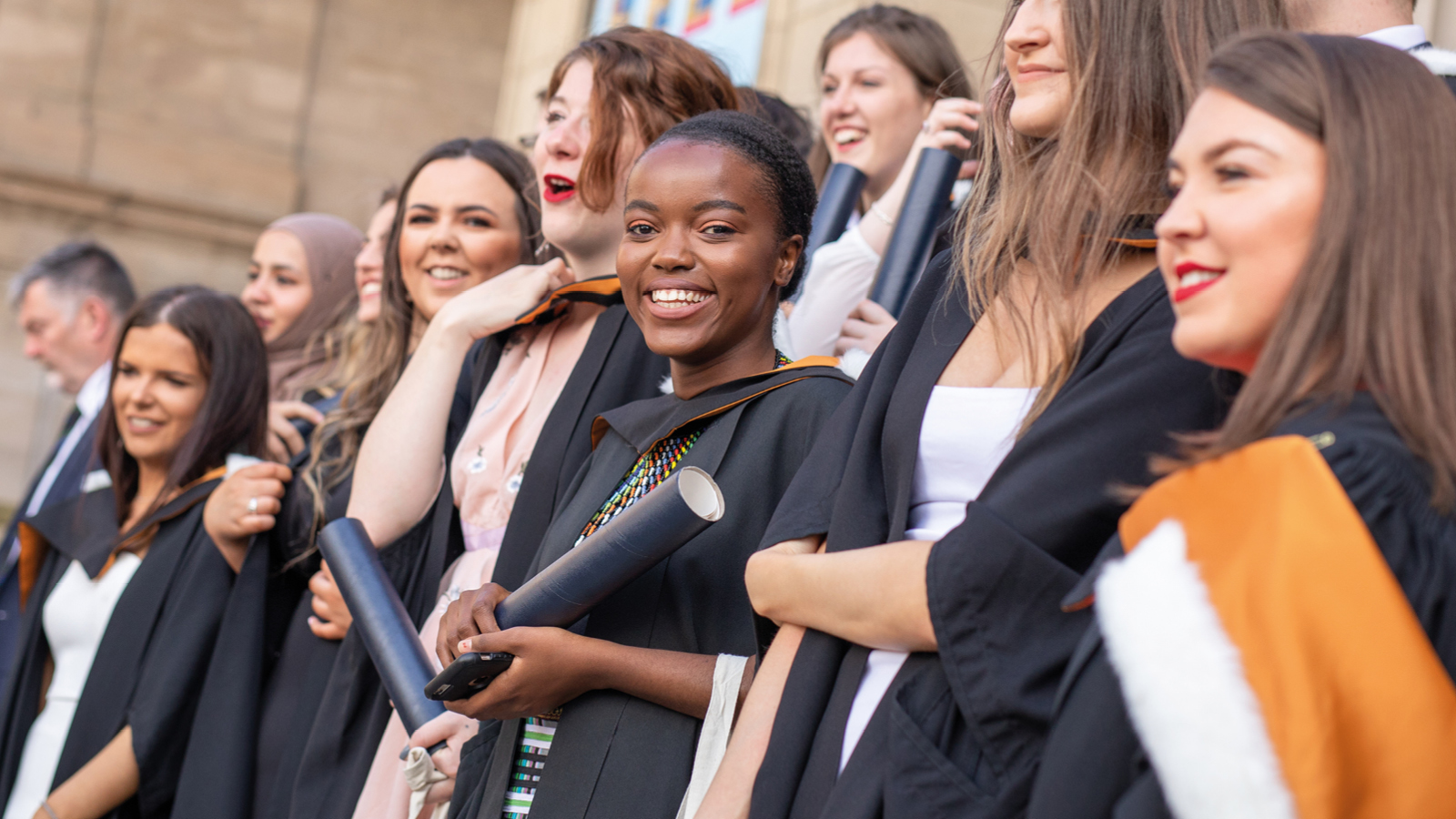 A group of female students in graduation ceremony.