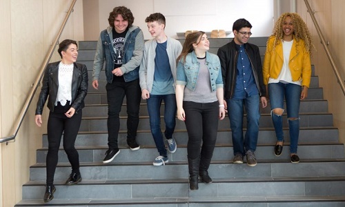 Young people walking down stairs.